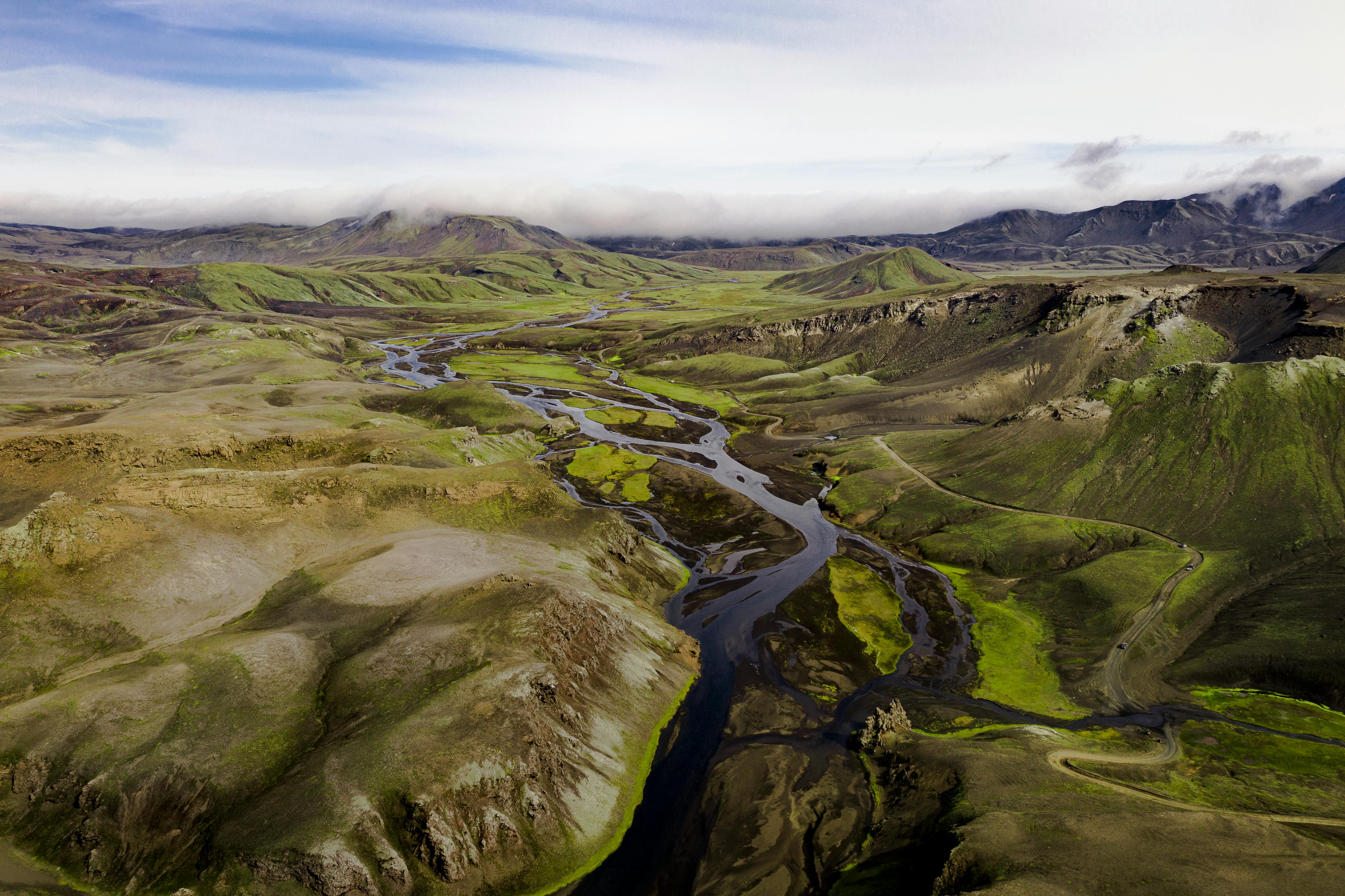 A breathtaking aerial shot capturing the vast, lush landscapes of Iceland's highlands.